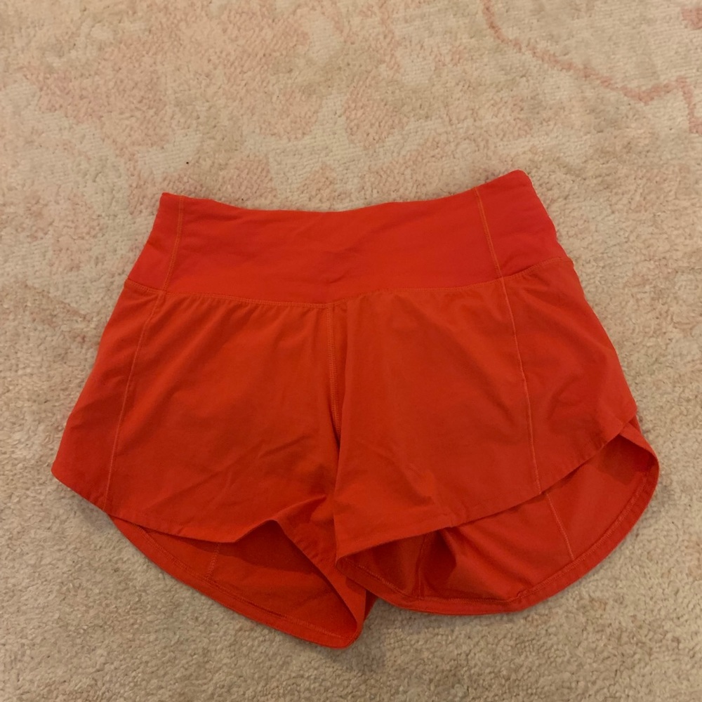 Carnation Red Lululemon shorts.